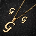 Golden stainless steel jewelry set featuring letter G necklace and stud earrings - Gold G