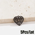 Detailed close-up of five black hollow heart pendants with intricate origami-style patterns - 5 Pieces / Geometric Hollow Heart Style (596 Black)