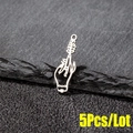 Macro shot of 5-piece set of silver gothic hand holding wheat pendants on a rock surface - 5 Pieces / Steel