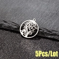 Macro shot of 5pcs set round cutout stainless steel tropical tree leaf pendants on stone - 5 Pcs/Bag / Steel