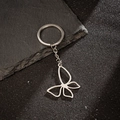 Macro shot of silver stainless steel hollow butterfly pendant on a metal keychain - Hollow Butterfly Style (165)