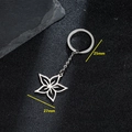 Silver stainless steel hollow flower keychain with 25mm ring on black stone background - Six-petal Star Flower Style (129)
