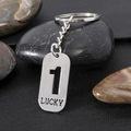 Portachiavi minimalista in acciaio inossidabile argento con numero 1 e scritta Lucky - Numero 1