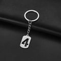 Polished stainless steel keychain featuring a hollow-out number four on a silver tag - Number 4