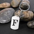 Polished silver stainless steel keychain featuring a hollowed-out letter F charm pendant - Letter F