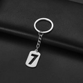Polished silver stainless steel keychain with hollow number 7 tag on black leather - Number 7