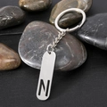 Polished stainless steel rectangular keychain pendant with hollow letter N engraving - Letter N