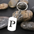 Polished stainless steel keychain featuring a rectangular tag with black letter P charm - Letter P