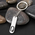 Polished stainless steel keychain with rectangular tag featuring hollow letter Q cutout - Letter Q