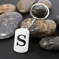 Polished stainless steel keychain with letter S cutout on smooth metal plate - Letter S