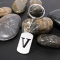 Polished silver stainless steel keychain featuring a black engraved letter V pendant - Letter V