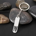 Minimalist silver stainless steel keychain featuring a rectangular cutout letter W charm - Letter W