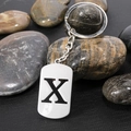 Polished stainless steel keychain with letter X pendant on decorative stones - Letter X