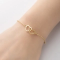 Pulsera minimalista de doble corazón dorado para mujer con elegantes eslabones de corazón - Dorado