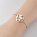 Pulsera de moda para mujer en acero inoxidable con colgante de mapa mundial plateado - Color Acero