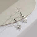 2025 S-shaped snake drop earrings in silver stainless steel with textured dot details - Steel