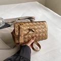 Handwoven crossbody bag in bronze gold leather with a signature metal knot buckle - Gold