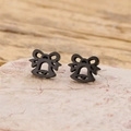 Macro shot of sweet black bow bell stud earrings on natural stone for Christmas gifts - Bow Bell Style (879) / Black