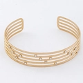 Close-up of gold titanium steel multi-layer cuff bracelet with sparkling crystal accents - Rhinestone Inlaid Layered Style