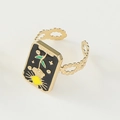 Detailed macro of gold adjustable ring with black enamel tarot sun and star pattern - Adjustable Open / Rectangular Black