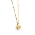 Detailed view of water-drop pendant in gold finish with starburst engraving and gemstone - Teardrop