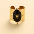 Adjustable gold wide ring with black enamel and gold starburst design on a warm beige backdrop - Adjustable Open / Black Oil Drop Star