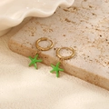 Detail of gold hoop earrings with vibrant green enamel starfish charms on stone surface - Green Starfish Hoop Earrings (Pair)
