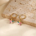 Detailed shot of gold hoop earrings with colorful starfish charms on a stone texture - Colorful Starfish Hoop Earrings (Pair)
