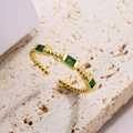 Vintage gold open ring with three emerald-cut green zircons on a white stone base - Slim Beaded Texture Three Green Gemstones Style (A4337)