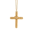 Detail of gold cross pendant with evil eye motif and sparkling center zircon crystal - Cross with Eye Detail