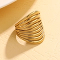 Detailed macro view of 14K gold-plated hollow multi-layer wavy wide statement ring - Gold
