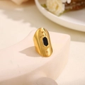 Wide gold-plated statement ring with black oval enamel inlay and geometric metal studs - Black