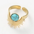 Detailed top view of a gold sunburst ring with a turquoise stone and textured metal - Turquoise Blue