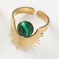 Macro detail of sunburst golden ring featuring a green malachite stone and open band - Malachite Green