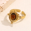 Vintage gold-plated ring featuring tiger eye stone and crystal accents on a stone surface - Gold-Brown (A4627)