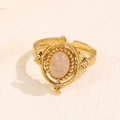 Vintage gold ring featuring a pink oval natural stone and side zircon accents - Gold-Rose Quartz (A4628)