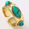 Textured gold-finish ring with emerald-green center stone and retro hammered metal details - Gold with Green Stone