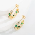 Golden C-shaped earrings with alternating emerald green and clear square zircon stones - Diamond-encrusted C-shaped Earrings Green Sold One-to-one.