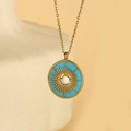 Collana con ciondolo sole turco in smalto azzurro con raggi dorati e perla bianca - Celeste