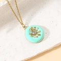 Ethnic gold chain necklace with light blue sunflower pendant and central zircon accent - Sky Blue