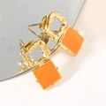 Vintage geometric earrings with hammered gold texture and bright orange resin pendants - Orange