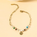 Gold stainless steel bracelet with colorful beads and a sun pendant charm - Sun