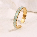 Adjustable evil eye ring in gold with light blue enamel circles on white stone - Blue