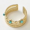 Detail of gold multi-layer ring with twisted texture and turquoise stone inlays - Gold with Blue Stone
