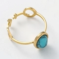 Gold stainless steel ring featuring an oval turquoise stone and female symbol design - Thin Zirconia Stainless Steel Ring (Blue)