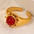 Vintage golden open ring featuring a round red natural stone with sunburst detailing - Red
