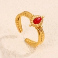 Adjustable golden stainless steel ring featuring a twisted band and red oval stone inlay - Red Style (A4777)