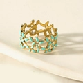 Golden hollow leaf ring with light blue enamel finish on minimalist stone background - Lake Blue