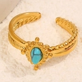 Adjustable golden twisted rope ring with oval turquoise stone and boho bead details - Blue Style (A4778)