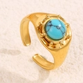 Bague ajustable en acier doré ornée d'une pierre de turquoise bleue ronde - Bleu